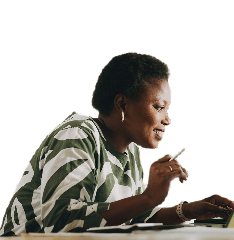 Smiling woman using a tablet for financial or educational purposes.