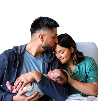 New parents with their newborn baby in a cozy home setting.