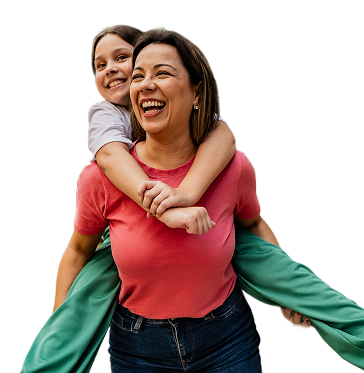 Happy woman and girl enjoying a piggyback ride outdoors.