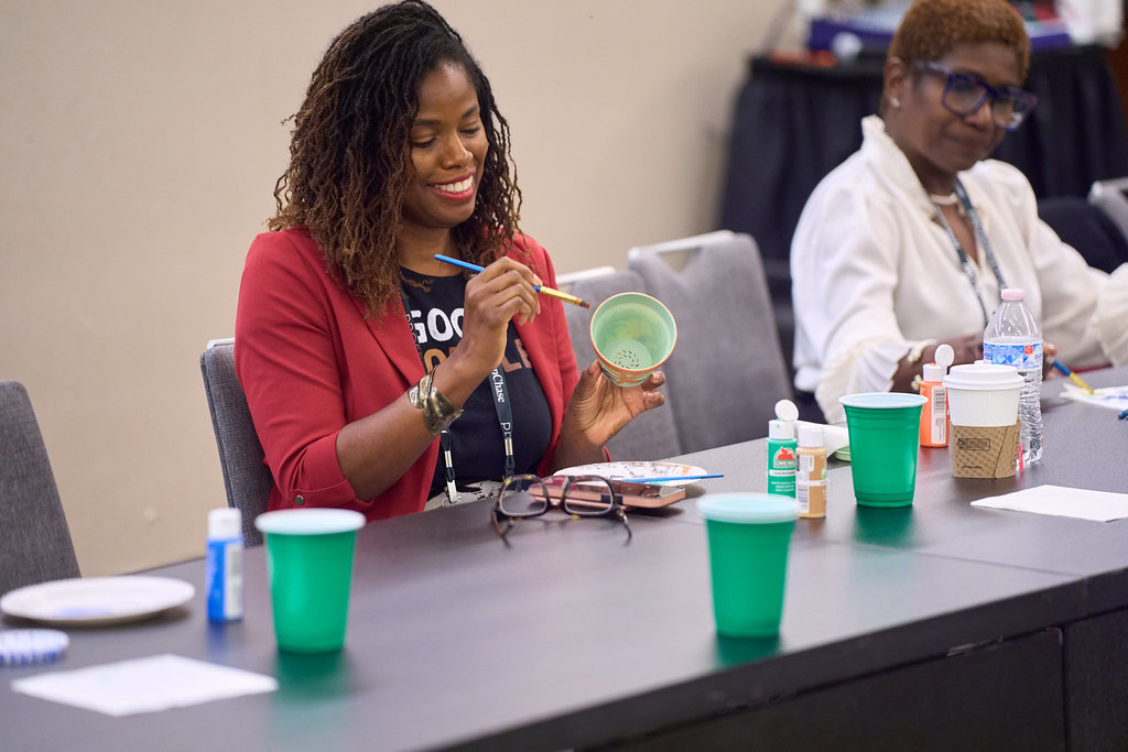 A participant in a hands-on activity at a Prosperity Now workshop.